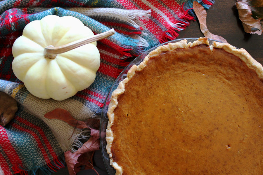 Pumpkin pie with a white pumpkin